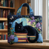 Borsa artigianale trapuntata con gatto nero sui libri